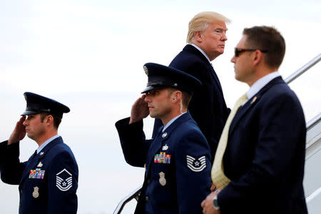 U.S. President Donald Trump boards Air Force One at John F. Kennedy International Airport in New York, before his departure back to Washington, U.S., December 2, 2017. REUTERS/Yuri Gripas