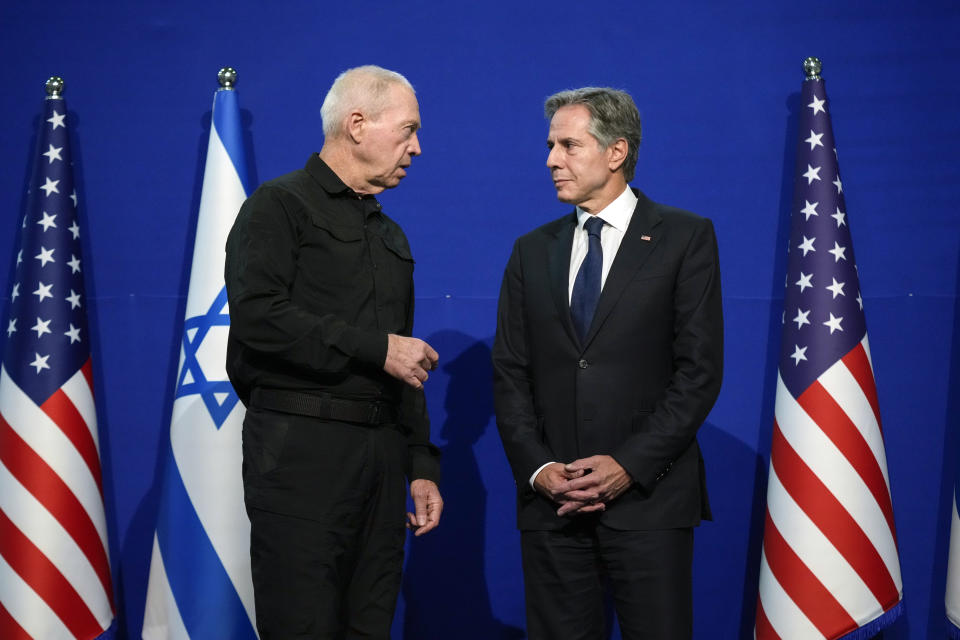 U.S. Secretary of State Antony Blinken, right, listens as Israeli Defense Minister Yoav Gallant speaks at The Kirya, Israel's Ministry of Defense, Monday, Oct. 16, 2023, in Tel Aviv. (AP Photo/Jacquelyn Martin, Pool)