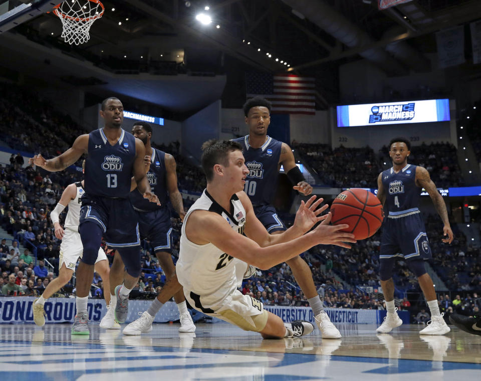 Purdue's Grady Eifert (24) dives to control a rebound against Old Dominion's Aaron Carver (13), Xavier Green (10) and Ahmad Caver (4) during the first half of a first round men's college basketball game in the NCAA Tournament, Thursday, March 21, 2019, in Hartford, Conn. (AP Photo/Elise Amendola)