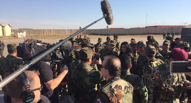 Kurdish pop star Helly Luv greeting troops in northern Iraq