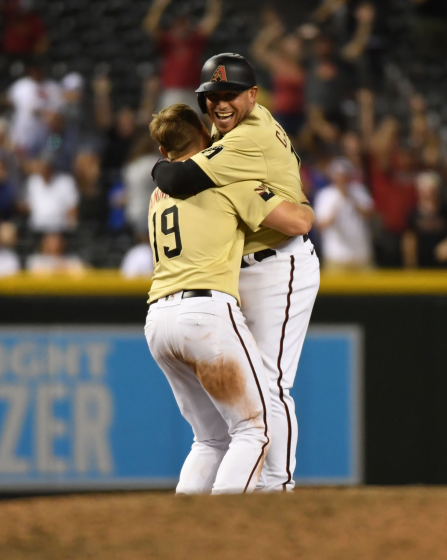 The Diamondbacks' Asdrubal Cabrera celebrates with Josh VanMeter after getting the game-winning hit against the Dodgers.