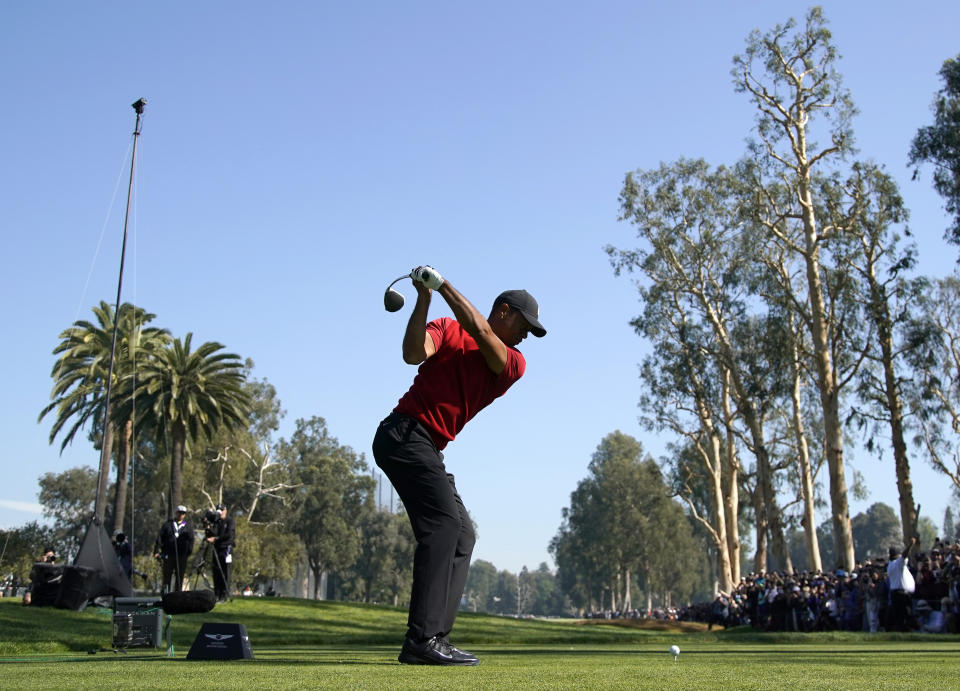 Tiger Woods tees off on the 12th hole during the final round of the Genesis Invitational golf tournament at Riviera Country Club, Sunday, Feb. 16, 2020, in the Pacific Palisades area of Los Angeles. (AP Photo/Ryan Kang)