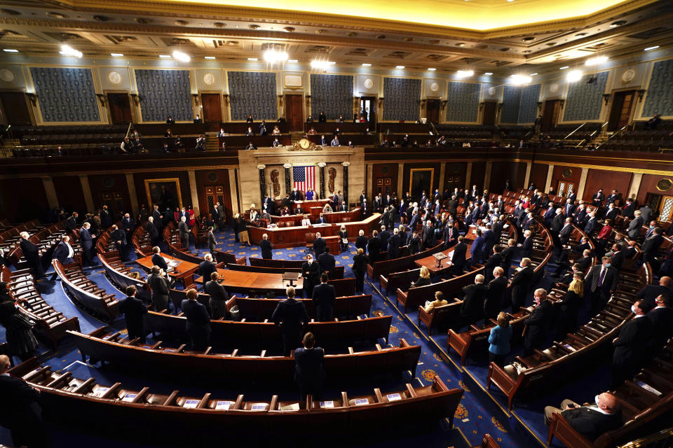 Speaker of the House Nancy Pelosi, D-Calif., and Vice President Mike Pence officiate as a joint session of the House and Senate convenes to confirm the Electoral College votes cast in November's election, at the Capitol in Washington, Wednesday, Jan. 6, 2021. (Jim Lo Scalzo/Pool via AP)