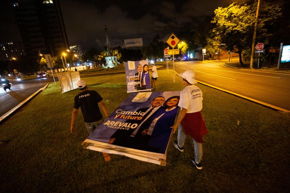 Movimiento Semilla volunteers set political signs for Bernardo Arevalo and Karin Herrera on Aug, 14, 2023, less than a week from the runoff election between Arevalo and Sandra Torres of UNE political party on Aug. 20, 2023.