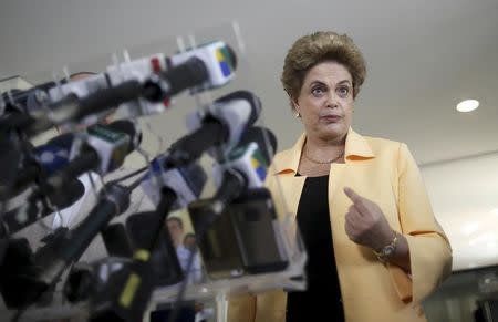 President Dilma Rousseff addresses a news conference after visiting the new Embraer KC 390 military transport aircraft in Brasilia, Brazil April 5, 2016. REUTERS/Adriano Machado