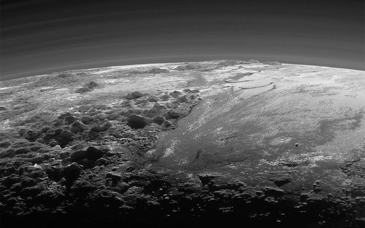 A close-up view of the rugged, icy mountains and flat ice plains on Pluto is seen in an image from NASA's New Horizons spacecraft - NASA /REUTERS
