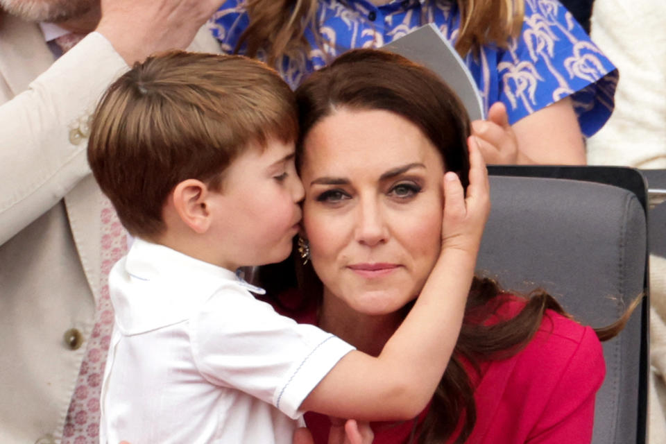 Britain's Catherine, Duchess of Cambridge, (R) is huged by her son Britain's Prince Louis of Cambridge (L) during the Platinum Pageant in London on June 5, 2022 as part of Queen Elizabeth II's platinum jubilee celebrations. - The curtain comes down on four days of momentous nationwide celebrations to honour Queen Elizabeth II's historic Platinum Jubilee with a day-long pageant lauding the 96-year-old monarch's record seven decades on the throne. (Photo by Chris Jackson / POOL / AFP) (Photo by CHRIS JACKSON/POOL/AFP via Getty Images)