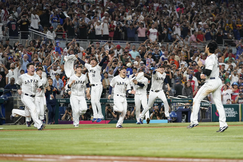 Japan players celebrate after defeating the United States in the World Baseball Classic championship game, Tuesday, March 21, 2023, in Miami. (AP Photo/Wilfredo Lee)