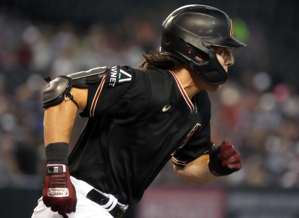 Arizona Diamondbacks Jake McCarthy (31) takes off for first base against the Milwaukee Brewers at Chase Field in Phoenix on April 12, 2023.