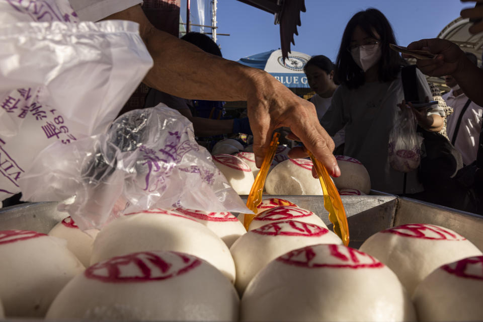 "Ping On" buns displayed for sale for the Bun Festival in Cheung Chau Island in Hong Kong, Friday, May 26, 2023. (AP Photo/Louise Delmotte)