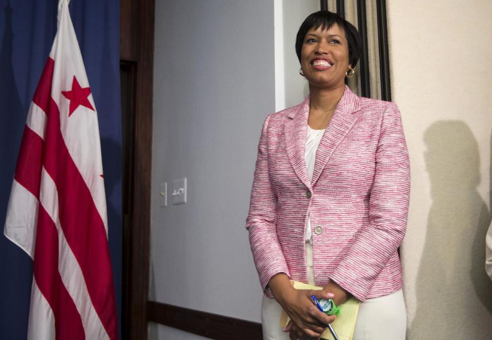 Washington Democratic Mayoral nominee Muriel Bowser arrives for a news conference a day after primary victory, Wednesday, April 2, 2014, at the National Press Club. Councilmember Bowser defeated Mayor Vincent Gray in Tuesday's Democratic mayoral primary, leaving Gray to serve nine months as a lame duck with potential criminal charges hanging over his head. (AP Photo/ Evan Vucci)