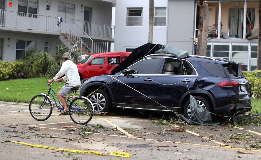 Cars damaged from the tornado at Kings Point 55+ community in Delray Beach, Fla., on Wednesday, Sept. 28, 2022. (Carline Jean/South Florida Sun-Sentinel via AP)