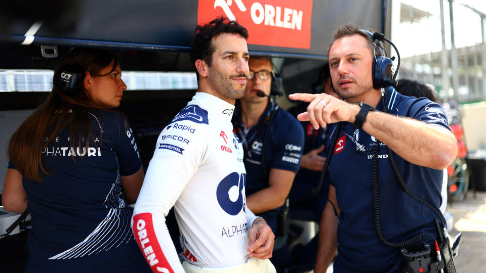 SAO PAULO, BRAZIL - NOVEMBER 05: Daniel Ricciardo of Australia and Scuderia AlphaTauri talks with Jonathan Eddolls, Head of Trackside Engineering for Scuderia AlphaTauri in the Pitlane during a red flag delay during the F1 Grand Prix of Brazil at Autodromo Jose Carlos Pace on November 05, 2023 in Sao Paulo, Brazil. (Photo by Dan Istitene - Formula 1/Formula 1 via Getty Images)