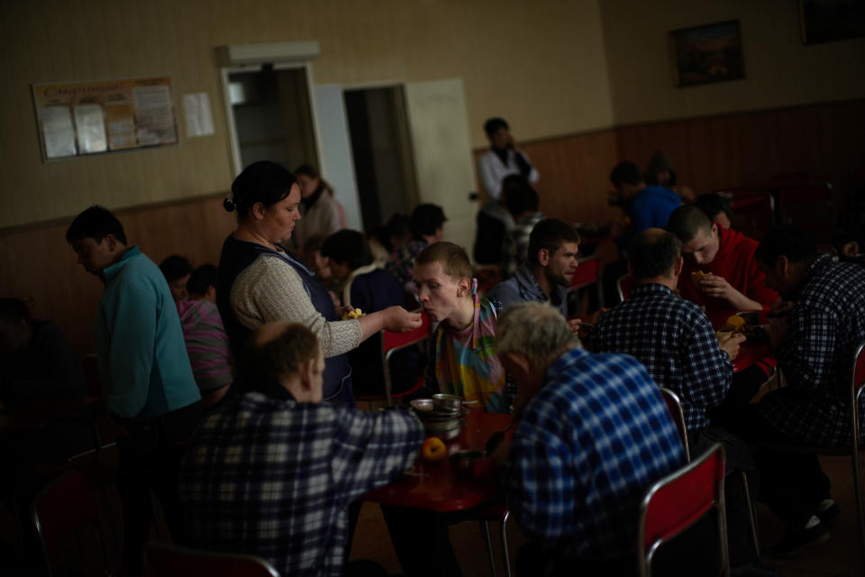 Residents have their lunch in a facility for people with mental and physical disabilities in the village of Tavriiske, Ukraine, Tuesday, May 10, 2022. With around 425 residents, the institution is the largest such facility for people with disabilities in southeastern Ukraine's Zaporizhzhia region. (AP Photo/Francisco Seco)