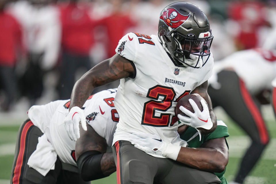 Tampa Bay Buccaneers running back Ke'Shawn Vaughn (21) is tackled by New York Jets' Tanzel Smart during the first half of a preseason NFL football game, Saturday, Aug. 19, 2023, in East Rutherford, N.J. (AP Photo/Seth Wenig)