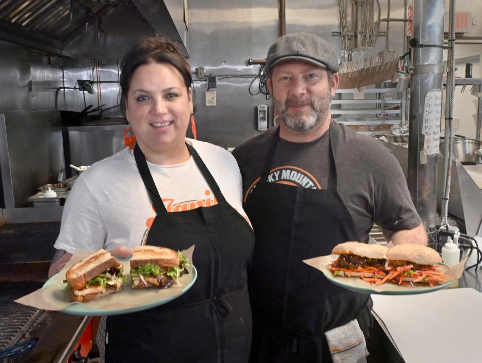 Owners Aanjes (left) and Hollis Hershfield last year with the Goddess sandwich (held by Aanjes) and Mother Clucker sandwich at Devour Artisan Eatery in Falmouth