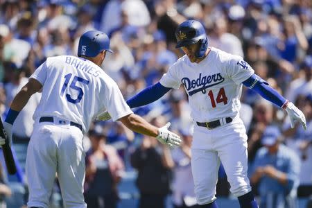 Mar 28, 2019; Los Angeles, CA, USA; Los Angeles Dodgers second baseman Enrique Hernandez (14) celebrates with catcher Austin Barnes (15) after a home run during the fourth inning against the Arizona Diamondbacks at Dodger Stadium. Mandatory Credit: Kelvin Kuo-USA TODAY Sports