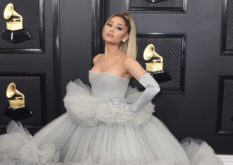 Ariana Grande in a grey tulle gown and gloves at the Grammys red carpet