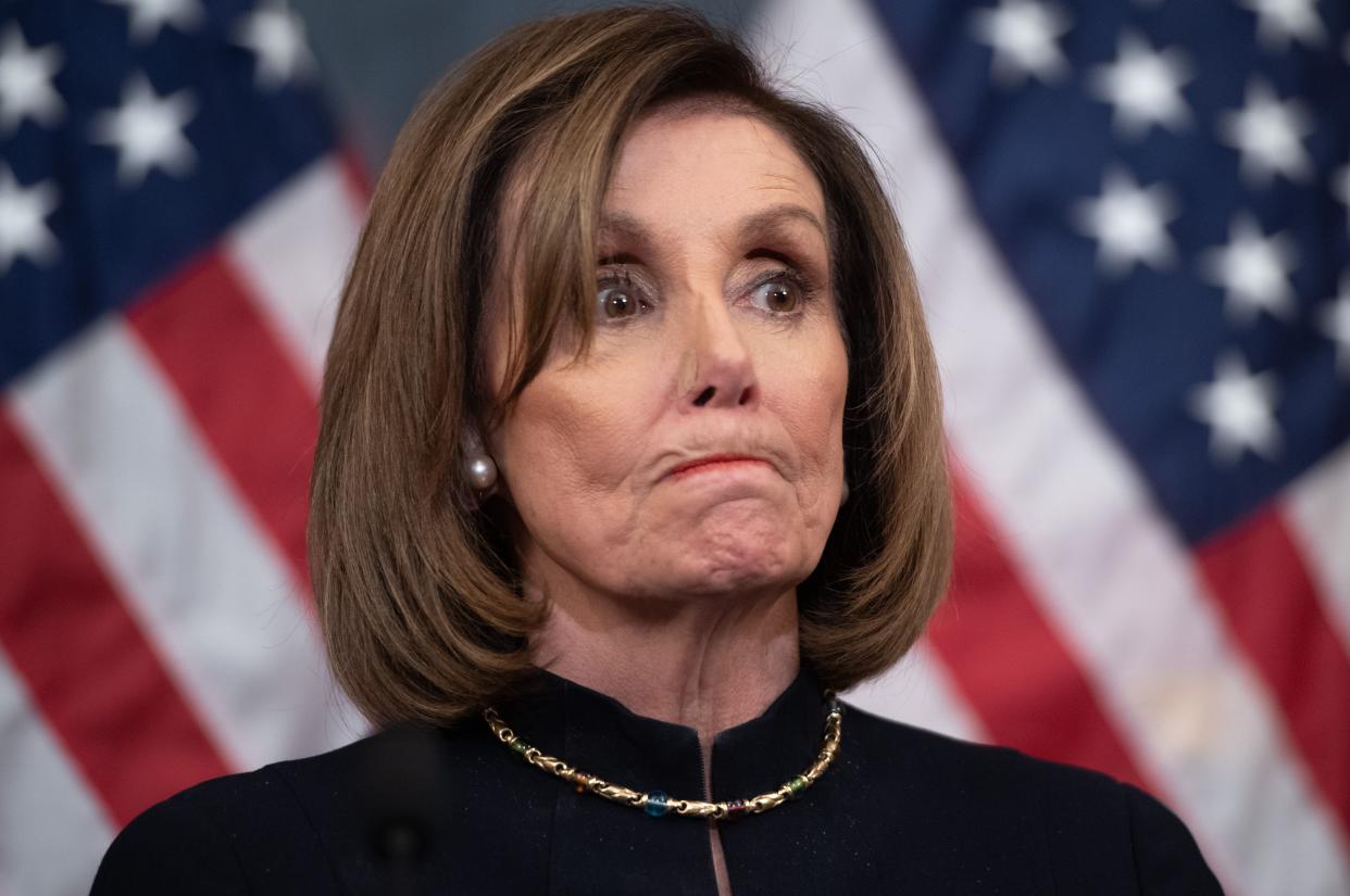 US Speaker of the House Nancy Pelosi holds a press conference after the House passed Resolution 755, Articles of Impeachment Against President Donald J. Trump, at the US Capitol in Washington, DC, on December 18, 2019. - The US House of Representatives voted 229-198 on Wednesday to impeach President Donald Trump for obstruction of Congress. The House impeached Trump for abuse of power by a 230-197 vote. The 45th US president is just the third occupant of the White House in US history to be impeached. (Photo by SAUL LOEB / AFP) (Photo by SAUL LOEB/AFP via Getty Images)