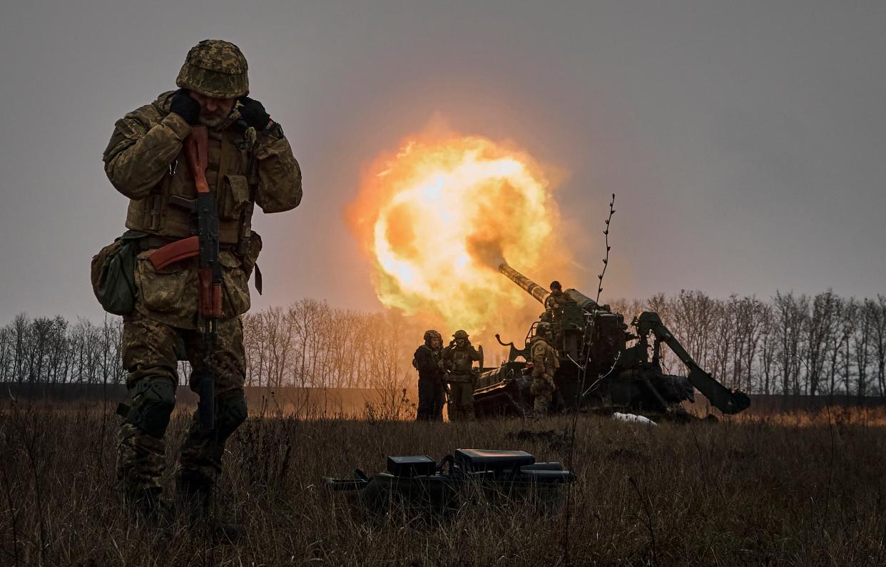Ukrainian soldiers fire a Pion artillery system at Russian positions near Bakhmut on 16 December (AP Photo/LIBKOS)