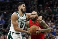 Boston Celtics' Jayson Tatum (0) fouls Toronto Raptors' Gary Trent Jr. during the second half of an NBA basketball game, Friday, Oct. 22, 2021, in Boston. (AP Photo/Michael Dwyer)