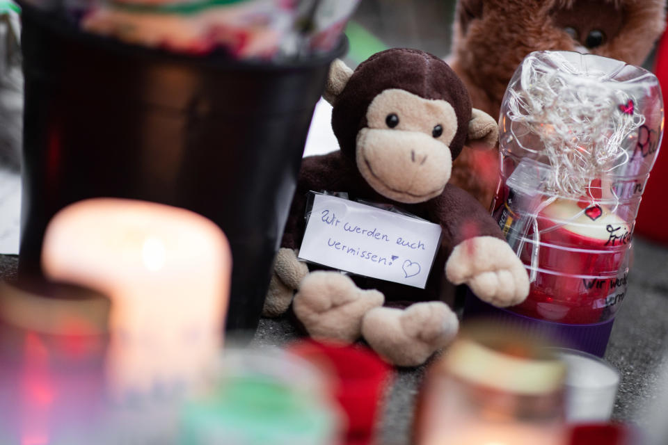 dpatop - 02 January 2020, North Rhine-Westphalia, Krefeld: "We'll miss you!" is written on a slip of paper stuck to a stuffed monkey. Numerous pictures, stuffed animals and candles are lying in front of the main entrance of the Krefeld Zoo. After the fire in the monkey house with many dead animals, there are, according to investigators, indications of so-called Chinese sky lanterns as the cause of the fire. Photo: Marcel Kusch/dpa (Photo by Marcel Kusch/picture alliance via Getty Images)