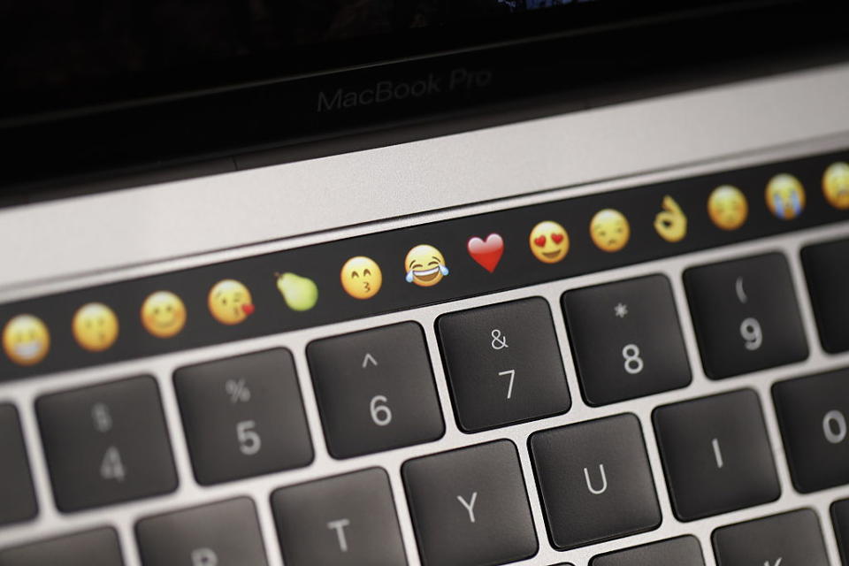 CUPERTINO, CA - OCTOBER 27: Emoticons are displayed on the Touch Bar on a new Apple MacBook Pro laptop during a product launch event on October 27, 2016 in Cupertino, California. Apple Inc. unveiled the latest iterations of its MacBook Pro line of laptops and TV app. (Photo by Stephen Lam/Getty Images)