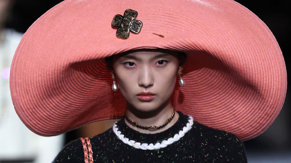 Oversized, floppy beach hats in a range of pink hues were a key feature at Chanel. - Pascal Le Segretain/Getty Images
