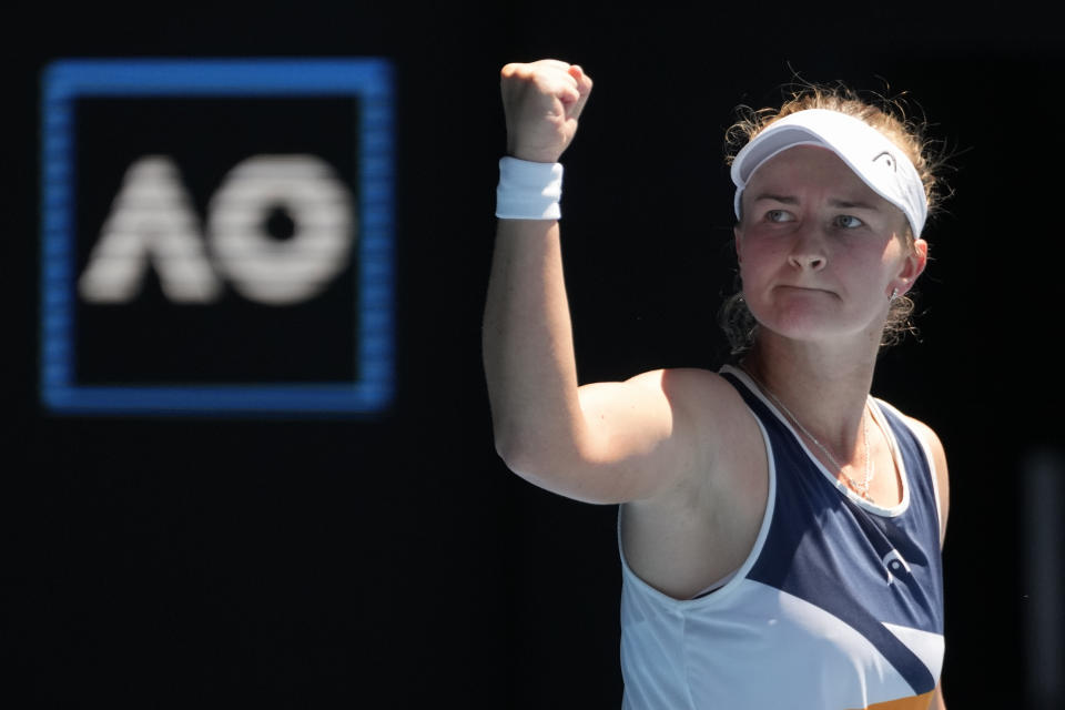 Barbora Krejcikova of the Czech Republic celebrates after defeating Victoria Azarenka of Belarus in their fourth round match at the Australian Open tennis championships in Melbourne, Australia, Sunday, Jan. 23, 2022. (AP Photo/Simon Baker)