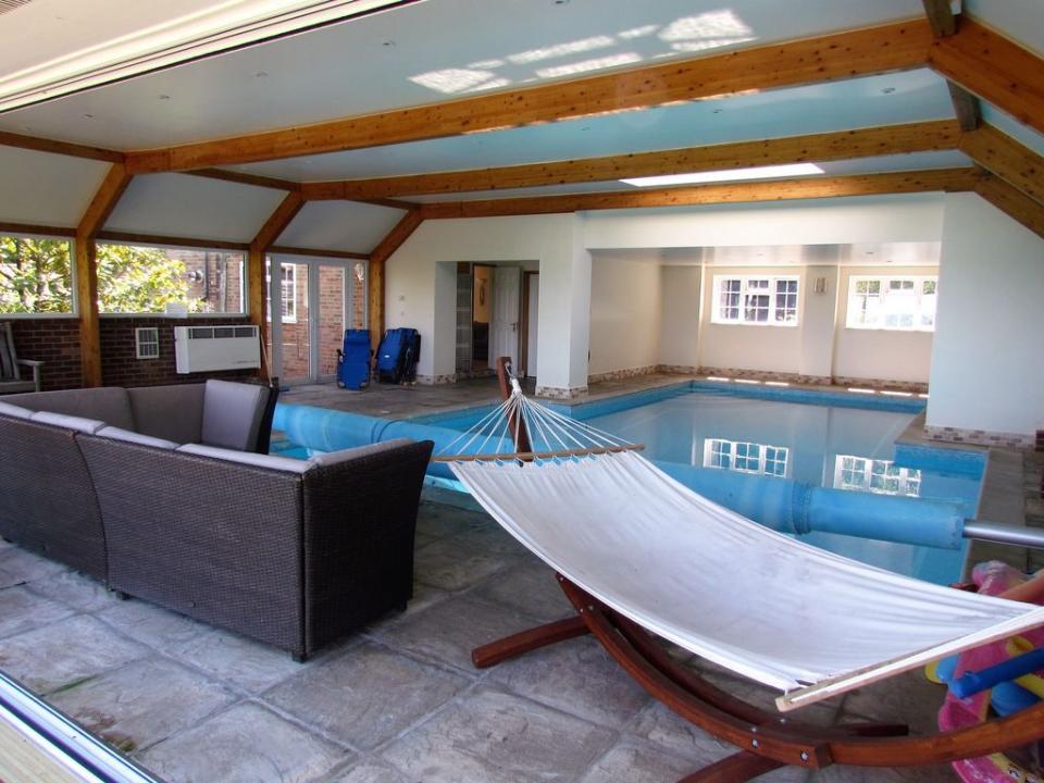 <p>With its epic views and home comforts, this cosy cottage with a pool is such a treat. The indoor heated pool is kept at around 30ºC and you'll love the large terrace overlooking the spectacular Rother Valley – one for relaxing with your morning smoothie and a <a href="https://www.womenshealthmag.com/uk/health/a32754870/racism-books-black-lives-matter/" rel="nofollow noopener" target="_blank" data-ylk="slk:good book;elm:context_link;itc:0;sec:content-canvas" class="link ">good book</a>. The lawn, walled garden and access to a field make it a place where you won't want to spend all your time holed up inside. </p><p><strong>Sleeps:</strong> 6</p><p><strong>Pets: </strong>Yes</p><p><strong>Bring:</strong> Your favourite book. There's a hammock for relaxing by the pool when you're not swimming laps. </p><p><strong>Price: </strong>2 nights from £425.60</p><p><strong>Available from: </strong><a href="https://go.redirectingat.com?id=127X1599956&url=https%3A%2F%2Fwww.homeaway.co.uk%2Fp8096220&sref=https%3A%2F%2Fwww.womenshealthmag.com%2Fuk%2Ffitness%2Ffitness-holidays%2Fg33559308%2Fcottages-with-pools%2F" rel="nofollow noopener" target="_blank" data-ylk="slk:HomeAway;elm:context_link;itc:0;sec:content-canvas" class="link ">HomeAway</a><br></p>