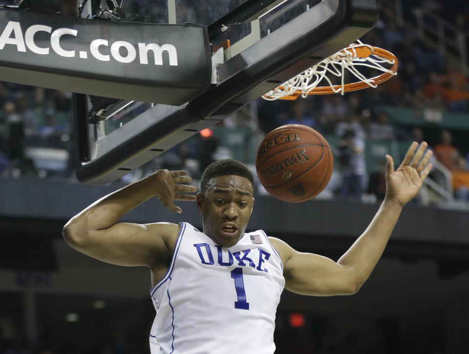 Duke's Jabari Parker (1) dunks against Clemson during the first half of a quarterfinal NCAA college basketball game at the Atlantic Coast Conference tournament in Greensboro, N.C., Friday, March 14, 2014. (AP Photo/Gerry Broome)