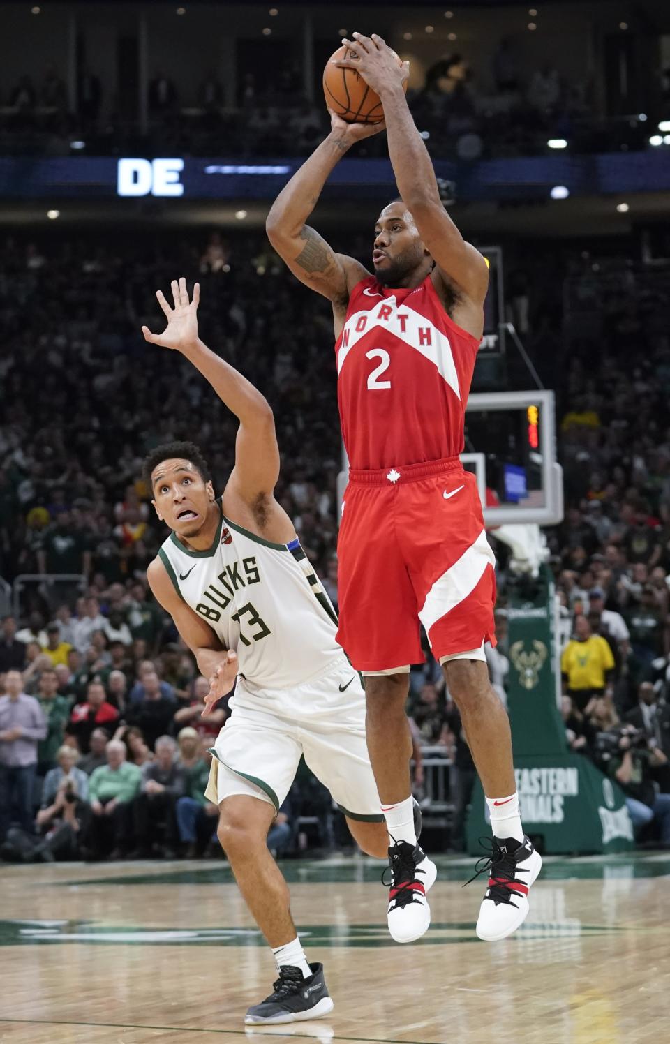 Toronto Raptors' Kawhi Leonard shoots in front of Milwaukee Bucks' Malcolm Brogdon during the second half of Game 5 of the NBA Eastern Conference basketball playoff finals Thursday, May 23, 2019, in Milwaukee. The Raptors won 105-99 to take a 3-2 lead in the series. (AP Photo/Morry Gash)