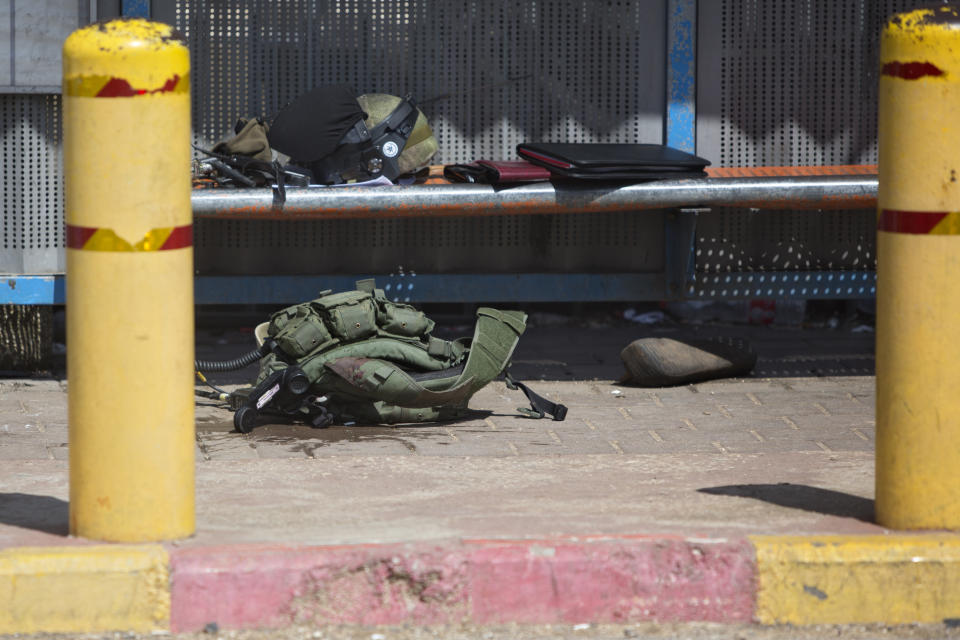 A vest of an Israeli soldier is seen on the ground at the scene of an attack near the West Bank Jewish settlement of Ariel, Sunday, March 17, 2019.The Israeli military says a Palestinian killed an Israeli and seriously wounded two others in a West Bank shooting and stabbing spree before fleeing and setting off a massive manhunt.(AP Photo/Sebastian Scheiner)