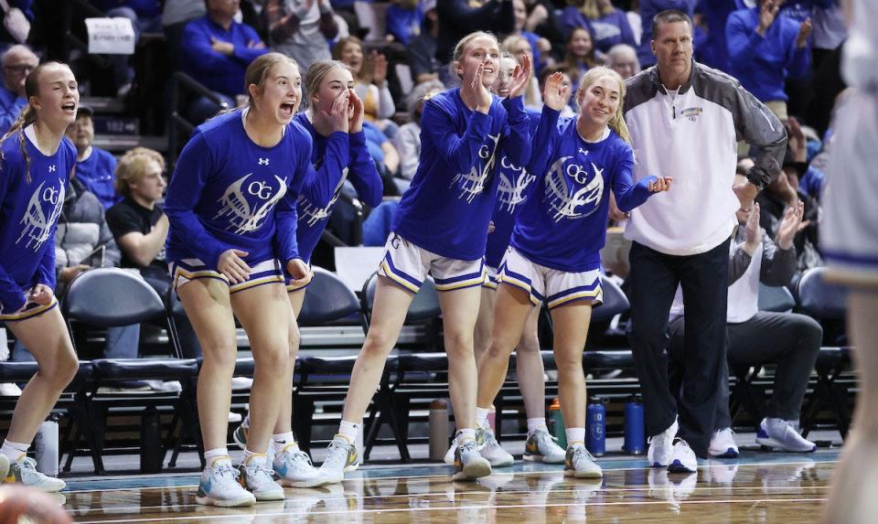 O'Gorman head coach Kent Kolsrud and players cheer on the Knights during their semifinal win over Sioux Falls Jefferson in the state Class AA girls basketball tournament on Friday, March 8, 2024 in the Sanford Pentagon at Sioux Falls.