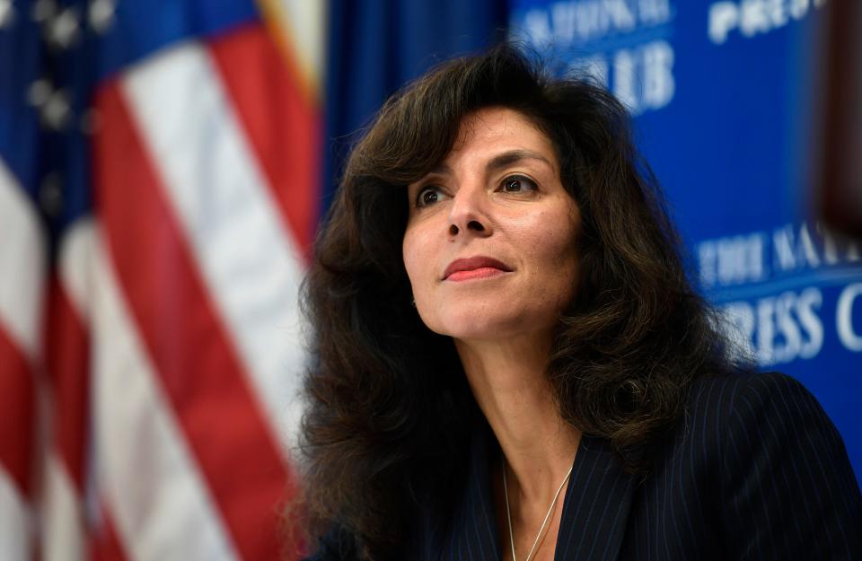 In this Sept. 21, 2018, file photo, Ashley Tabaddor, a federal immigration judge in Los Angeles who serves as the president of the National Association of Immigration Judges, listens as she is introduced to speak at the National Press Club in Washington, D.C., on the pressures on judges and the federal immigration court system. Immigration judges say they are being muzzled by the Trump administration and the union that represents them is suing the U.S. Department of Justice. The lawsuit filed Wednesday, July 1, 2020, is the latest confrontation between the judges and the Justice Department, which oversees U.S. immigration courts.