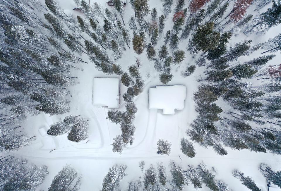 In an aerial view, homes are covered in snow following a massive snowstorm in the Sierra Nevada mountains on March 04, 2024 near Soda Springs (Getty Images)