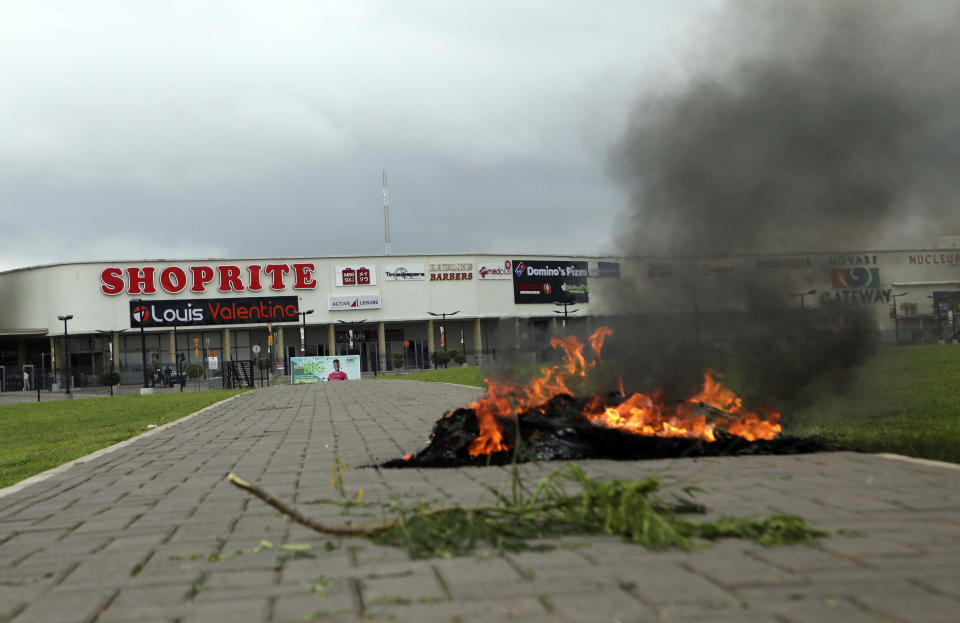 A bonfire is set outside Shoprite during a protest in Abuja, Nigeria Wednesday. Sept. 4, 2019. South African-owned businesses operating in Nigeria are being targeted with violence in retaliation for xenophobic attacks carried out against Africans working in South Africa. Police in South African arrested more than 100 people in five areas impacted by days of violence in Johannesburg and Pretoria. (AP Photo)