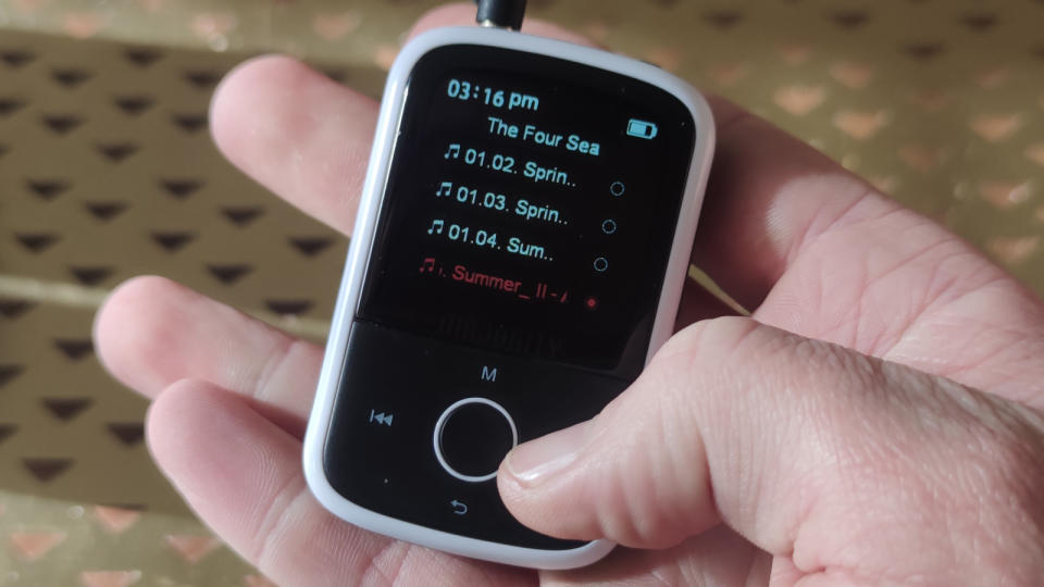 The Majority MP3 Player in a man's hands.