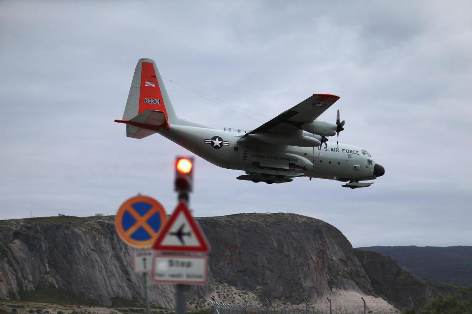 A pilot from the New York Air National Guard lands the ski-equipped National Science Foundation C-130 in Kangerlussuaq. (Photo: Joe Raedle via Getty Images)