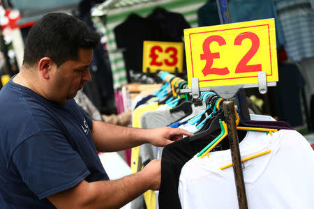 A man browses a market stall in London, Britain May 16, 2017. REUTERS/Neil Hall