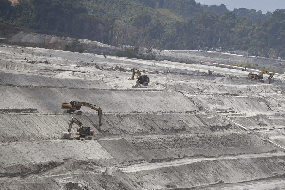 Bulldozers operate at the Cobre Panama open-pit copper mine in Donoso, Panama, Thursday, Jan. 11, 2024. Panama's Commerce Ministry is expected to make its first technical inspection of this mine on Thursday, since the Supreme Court ruled that the government's concession with the Canadian mining company First Quantum Minerals was unconstitutional, and start the process of closing it. (AP Photo/Agustin Herrera)