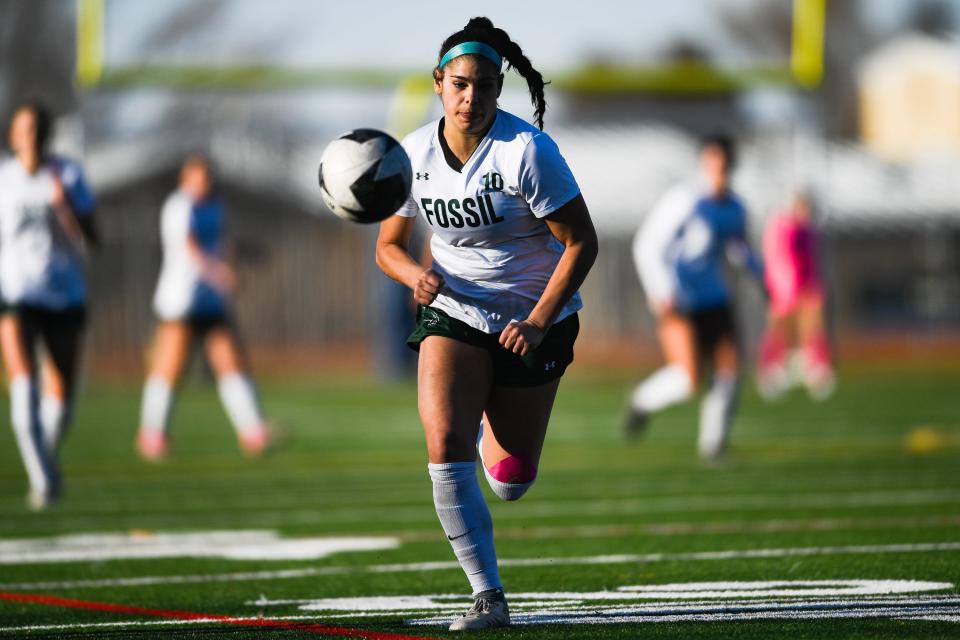 Fossil Ridge girls soccer player Abby Ballek (10) chases a ball during a match against Poudre on April 6, 2023, at Poudre High School in Fort Collins. The SaberCats won 4-1.