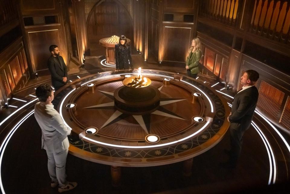 The Traitors gather around a fire pit (BBC/Studio Lamberty/Paul Chappells)