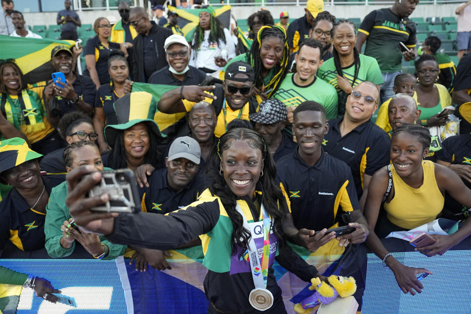 Shericka Jackson, of Jamaica, celebrates with fans after winning the final of the women's 200-meter run at the World Athletics Championships on Thursday, July 21, 2022, in Eugene, Ore. (AP Photo/David J. Phillip)