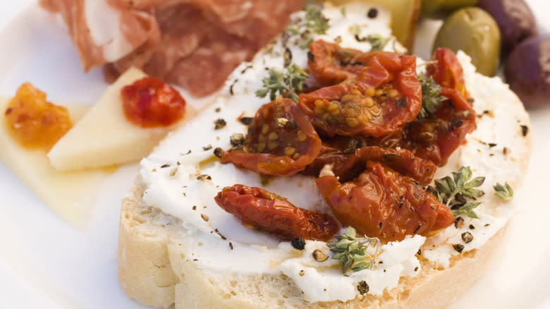 bread with whipped cheese and sun dried tomatoes