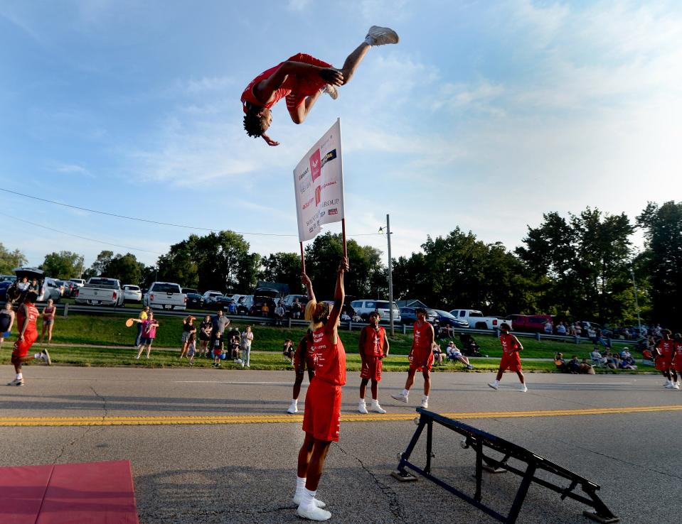 Members of the Jesse White Tumbling Team perform during the Illinois State Fair Twilight Parade Thursday, August 10, 2023.