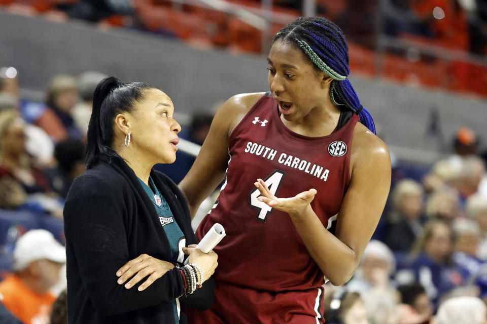 South Carolina head coach Dawn Staley talks with forward Aliyah Boston (4) during a game against Auburn Thursday, Feb. 9, 2023, in Auburn, Ala. (AP Photo/Butch Dill)