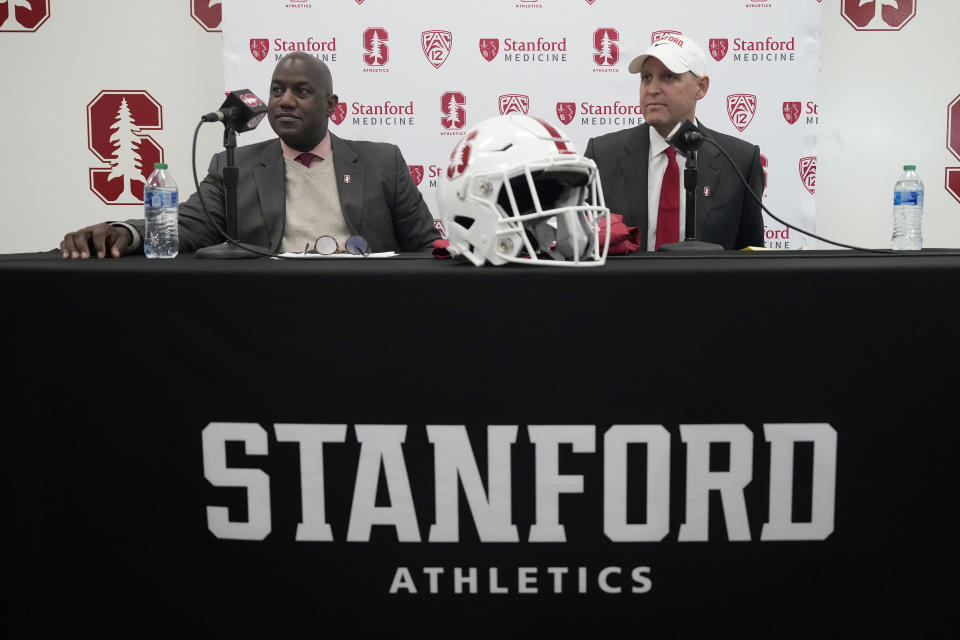 Bernard Muir, left, athletic director at Stanford, and Troy Taylor, right, Stanford's new head NCAA college football coach, attend a news conference, Monday, Dec. 12, 2022, in Stanford, Calif. (AP Photo/Tony Avelar)