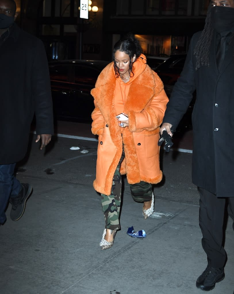 Rihanna out and about in NYC in an orange coat and Gucci x Balenciaga Knife heels on Jan. 26, 2022. - Credit: WavyPeter / SplashNews.com