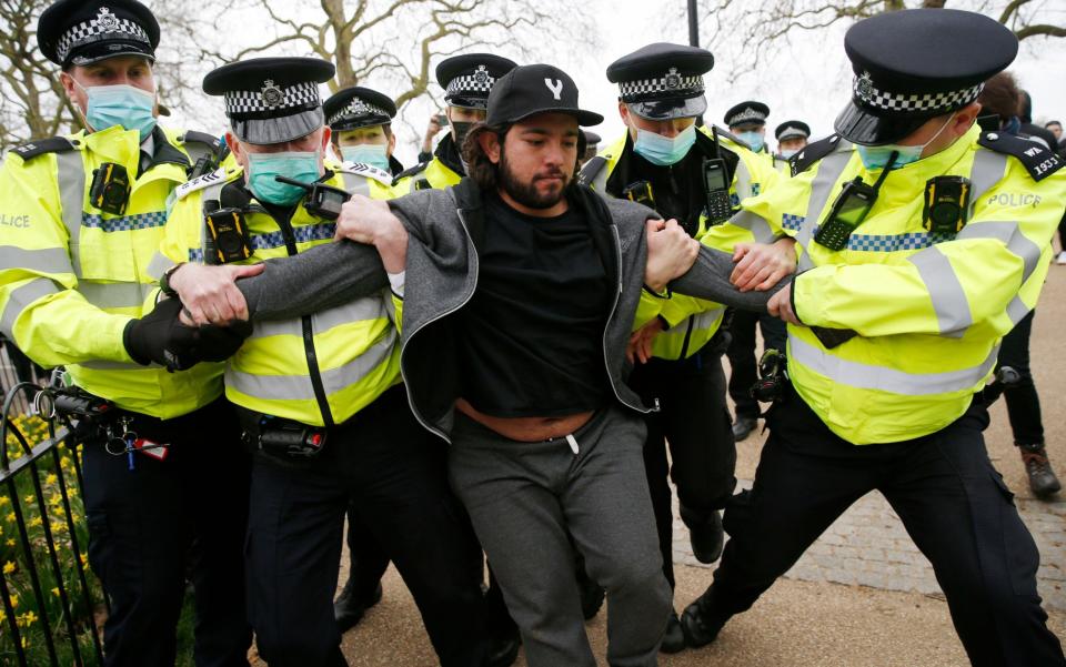 A protester is apprehended by police during a "World Wide Rally For Freedom" protest on March 20 -  Hollie Adams/Getty Images Europe